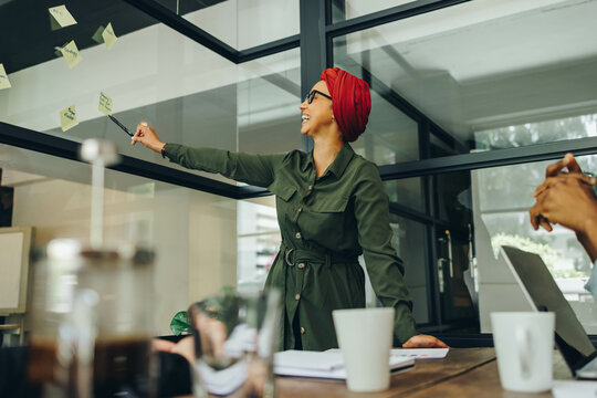 Brainstorming with adhesive notes - Powered by Adobe