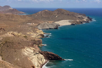 Panoramic view of cliffs and beaches in the Gata Cape Natural Park coast near San José. Almería, Andalucía, Spain.