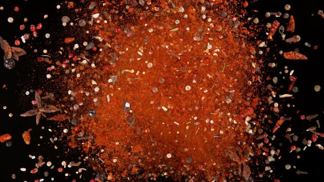 Super Slow Motion Shot of Flying and Rotating Colorful Mix Spices at 1000fps.