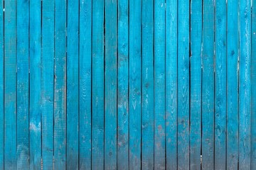 Fototapeta na wymiar blue wooden fence with old paint