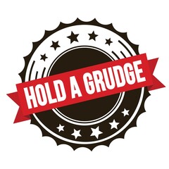 HOLD A GRUDGE text on red brown ribbon stamp.