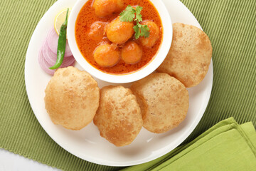 Indian food - Puri Bhaji. North India. Puri is a deep fried bread made from whole wheat flour & Served with Potato curry , bhaji or alu ki sabji.or Potato curry or dum alu curry