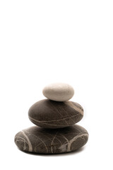 A stack of stones on a white isolated background .Balance and harmony. Copy space.Vertical photo. Spa and healthcare concept.