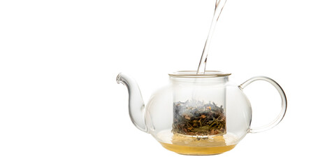 herbal tea served in a transparent glass teapot isolated over white backgound ready for breakfast or tea ceremony