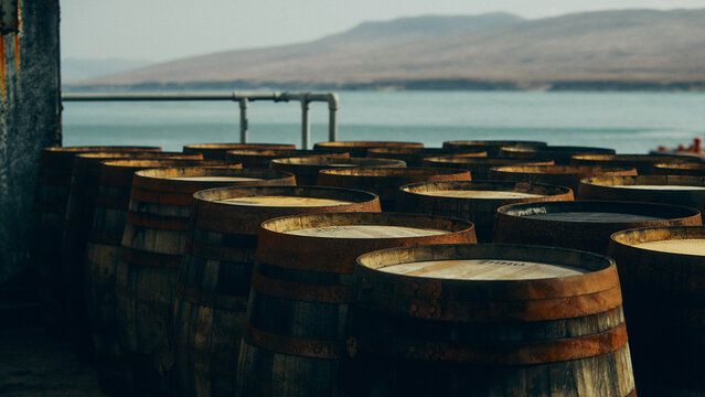 wooden barrels by the water