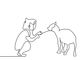 a little boy who loves feeding a small animal