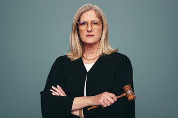 Mature judge looking at the camera in a studio