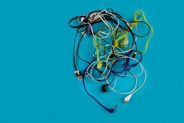 A lot of tangled headphones for smartphone