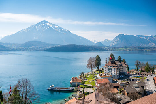 Lake Thun, Niesen and Parkhotel Gunten on a spring day seen from Gunten