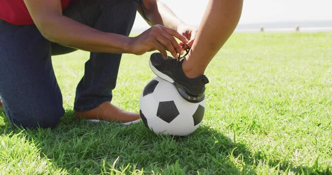 Video Of Midsection Of African American Father Tying Shoe To His Son