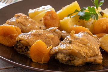 apricot chicken with potatoes on a plate