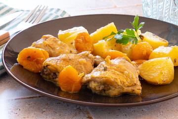 apricot chicken with potatoes on a plate
