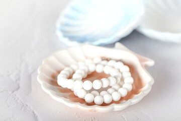 a shell-shaped stand made of gypsum. handmade, seashell. the product is made of gypsum.