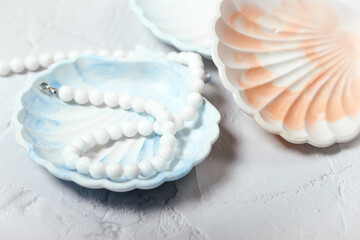Fototapeta na wymiar a shell-shaped stand made of gypsum. handmade, seashell. the product is made of gypsum.