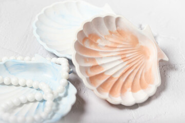 Obraz na płótnie Canvas a shell-shaped stand made of gypsum. handmade, seashell. the product is made of gypsum.