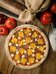Eggplant dish, pizza in a restaurant on a wooden table
