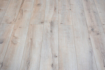 plank surface. wooden floor in the room. linoleum and laminate for finishing and repair works. cope...