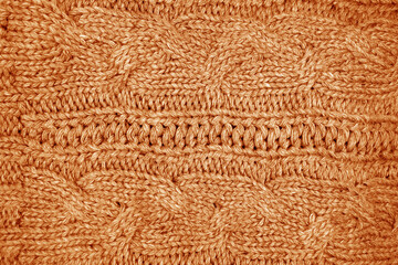 Warm knitting texture in orange tone.