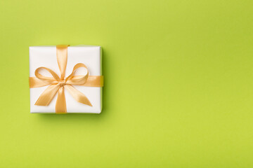 White gift box on color background, top view