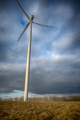 Fototapeta premium Electric wind turbine generating with blue sky and turbo generator
