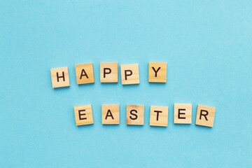 the inscription happy easter on blue background.