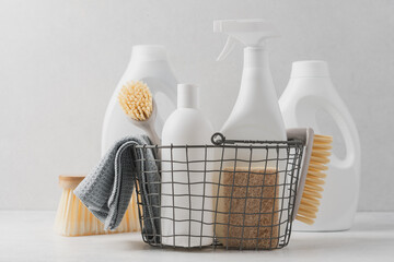 Set of detergents In basket. Cleaning agent, rag, sponge, brushes. Cleaning service concept