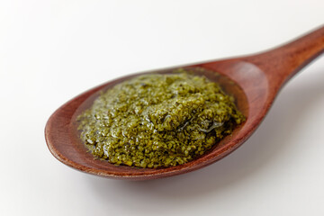 Basil pesto on a white background