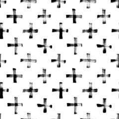 Fototapeta premium Black crosses vector seamless pattern. Hand drawn cross and plus sign with grunge texture. Geometrical pattern with black paint brush strokes. Hipster monochrome texture. Trendy graphic design.