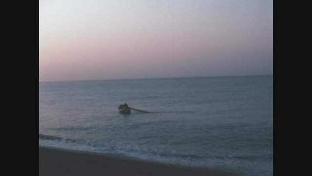 France 1975, Small fishing boat on the sea at sunset