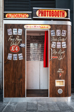 Automatic Hot Shots photobooth in Spitalfields Market, London. Old fashioned cabin for instant selfies.
