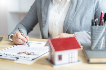 Insurance concept the realtor dealing with a customer and signing on a contract of property