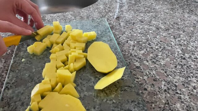 Preparing scrambled egg with potato pepper and mushroom at home for sunday breakfast  