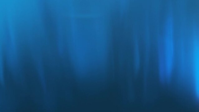 Abstract Underwater Ocean Wallpaper, Deep Blue Liquid with Streaks of Light Glowing in Slow Motion, 4K Video Background for Website Header or Zoom Call