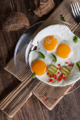 Fried eggs from two eggs on a plate, top view, healthy breakfast concept