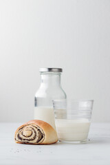 Sweet homemade poppy seed buns with milk for the breakfast
