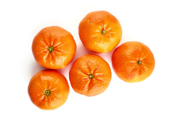 Tangerine or clementine, close-up, isolated on a white background.