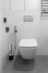 bathroom interior with white toilet and bidet