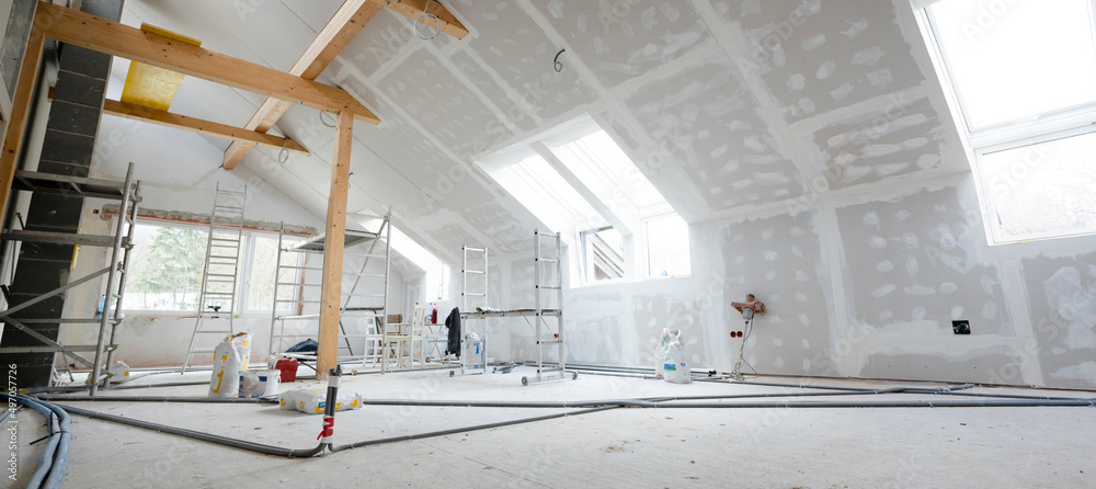 Wall mural attic finishing construction site in the phase drywall spackling and plastering before screeding