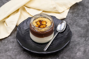 Banana magnolia dessert on dark background. World cuisine delicacies. close up