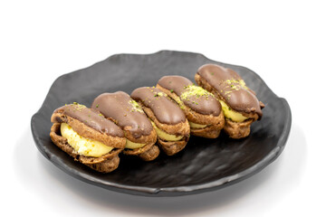 Chocolate eclair cake isolated on white background. World cuisine delicacies. close up