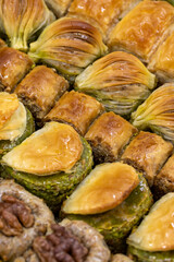 Walnut baklava. Varieties of baklava with walnuts in a tray. Traditional Turkish cuisine delicacies. Close-up baklava background.