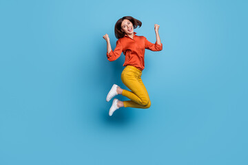 Fototapeta na wymiar Full length body size view of attractive cheerful lucky slim girl jumping rejoicing isolated over bright blue color background