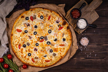 Top view of delicious and crispy pizza. American or Italian pizza. Cooking background concept.