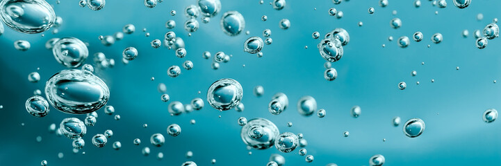 Close up macro Aloe vera gel cosmetic texture blue background with bubbles. Lemongrass gel skincare...
