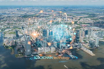Fototapeta na wymiar Aerial panoramic helicopter city view of New Jersey City financial Downtown skyscrapers. Decentralized economy. Blockchain, cryptography and cryptocurrency concept, hologram