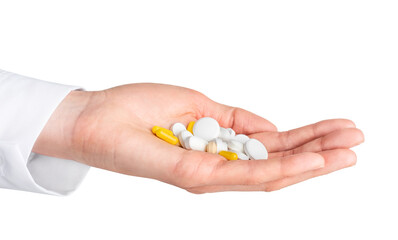 Human hand holding pills isolated on white background. Pharmacy, pharmacology, medicine background