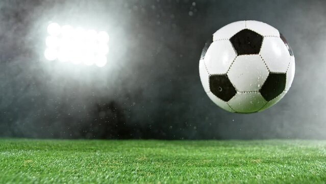 Super slow motion of soccer player kicking the ball. Filmed on high speed cinema camera, 1000fps.