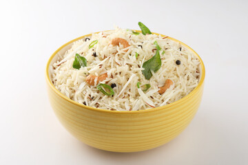 Coconut Rice is a popular South Indian food, served in a ceramic bowl. selective focus