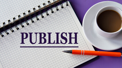 PUBLISH - word in a white notebook on a purple background with a cup of coffee