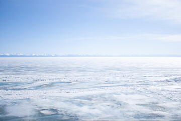 Winter landscape. Frozen lake. Blue sky. Background for postcards and banners.